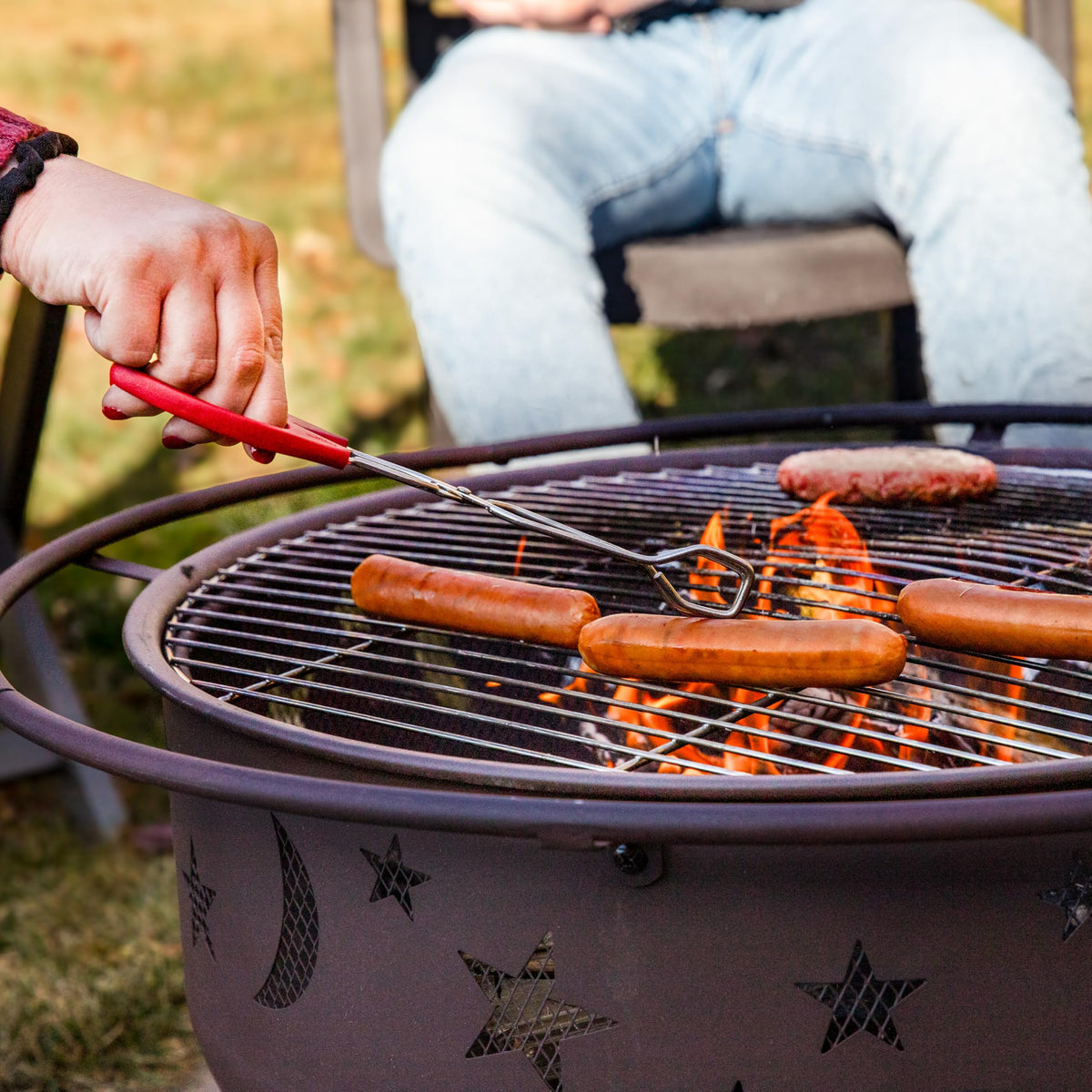 Sunnydaze Cosmic 30-Inch Outdoor Fire Pit - Wood Burning Fire Pit with Cooking BBQ Grill Grate, Spark Screen, and Fireplace Poker - Celestial Design